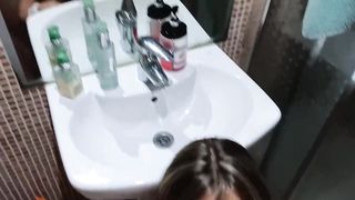 Frisky amateur babe is sucking dick in the bathroom before getting fucked hard from the back