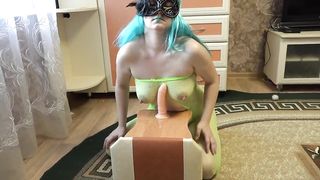 Chubby, amateur woman is bouncing up and down while riding a dildo in front of the camera