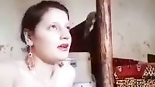 Amateur milf with big tits is posing in front of the camera with no clothes on