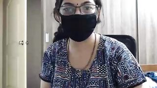 Masked Indian MILF with glasses poses naked on webcam