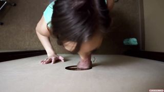 Amateur brunette is sucking a rock hard dick through a gloryhole and expecting a facial cumshot