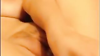 Horny babe with pink hair and big boobs is about to start moaning while masturbating on cam