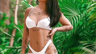 Mirella Safadinha is a smoking hot chick with tattoos who likes to do naughty stuff on cam