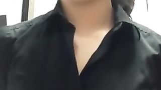 Cute Asian makes a Flash Video at Work.
