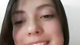 Beautiful brunette amateur is teasing her friend on webcam with just a hints of her boobs