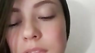 Beautiful brunette amateur is teasing her friend on webcam with just a hints of her boobs